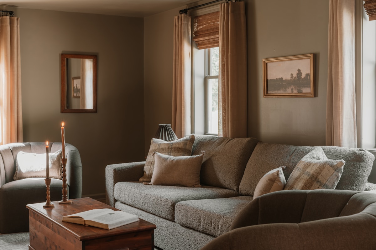 Framed artwork above a sofa in a collector interior